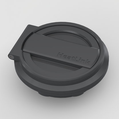Hero front view of HeatLink diesel heater port accessory showing sleek, low-profile weatherproof lid and molded branding.